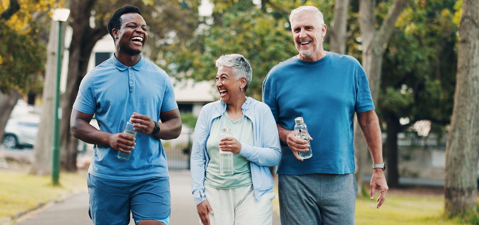 Seniors walking with water
