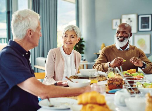 Three residents having breakfast