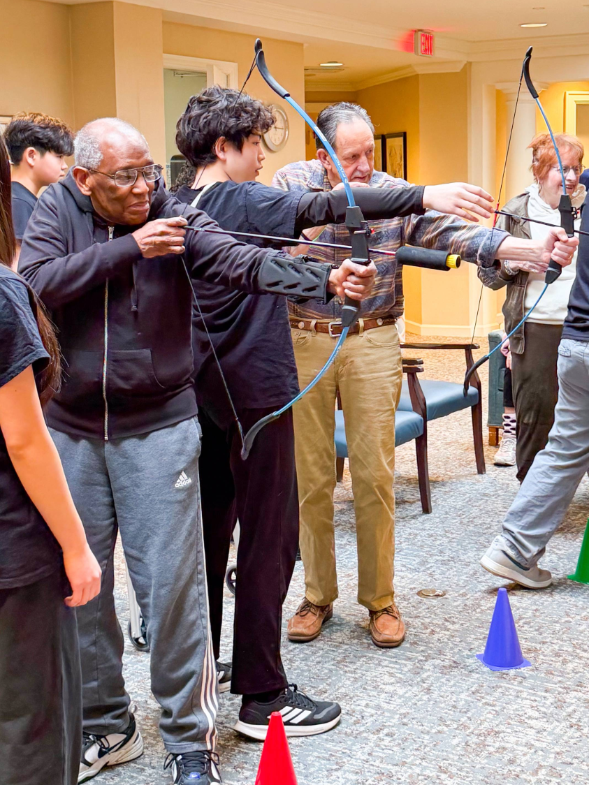 Senior living residents learning archery