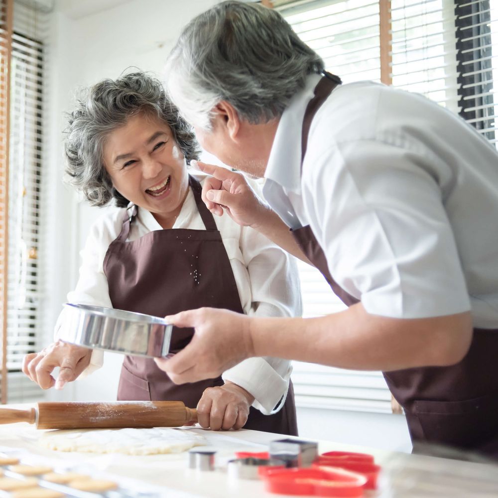 Couple baking cookies