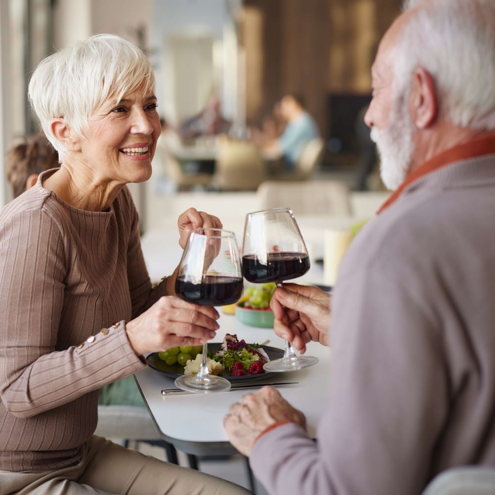Residents toasting at dinner