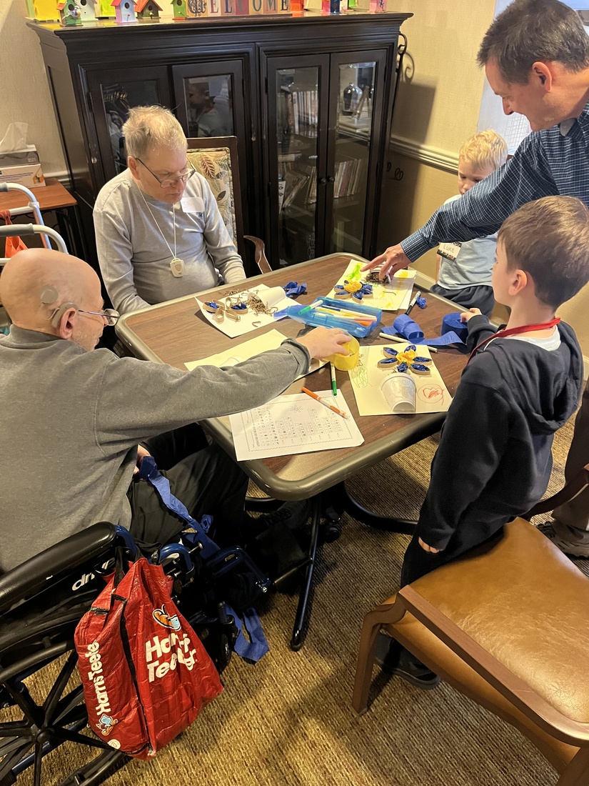 Students from a local elementary school visit Sunrise of Rockville to do crafts with residents.