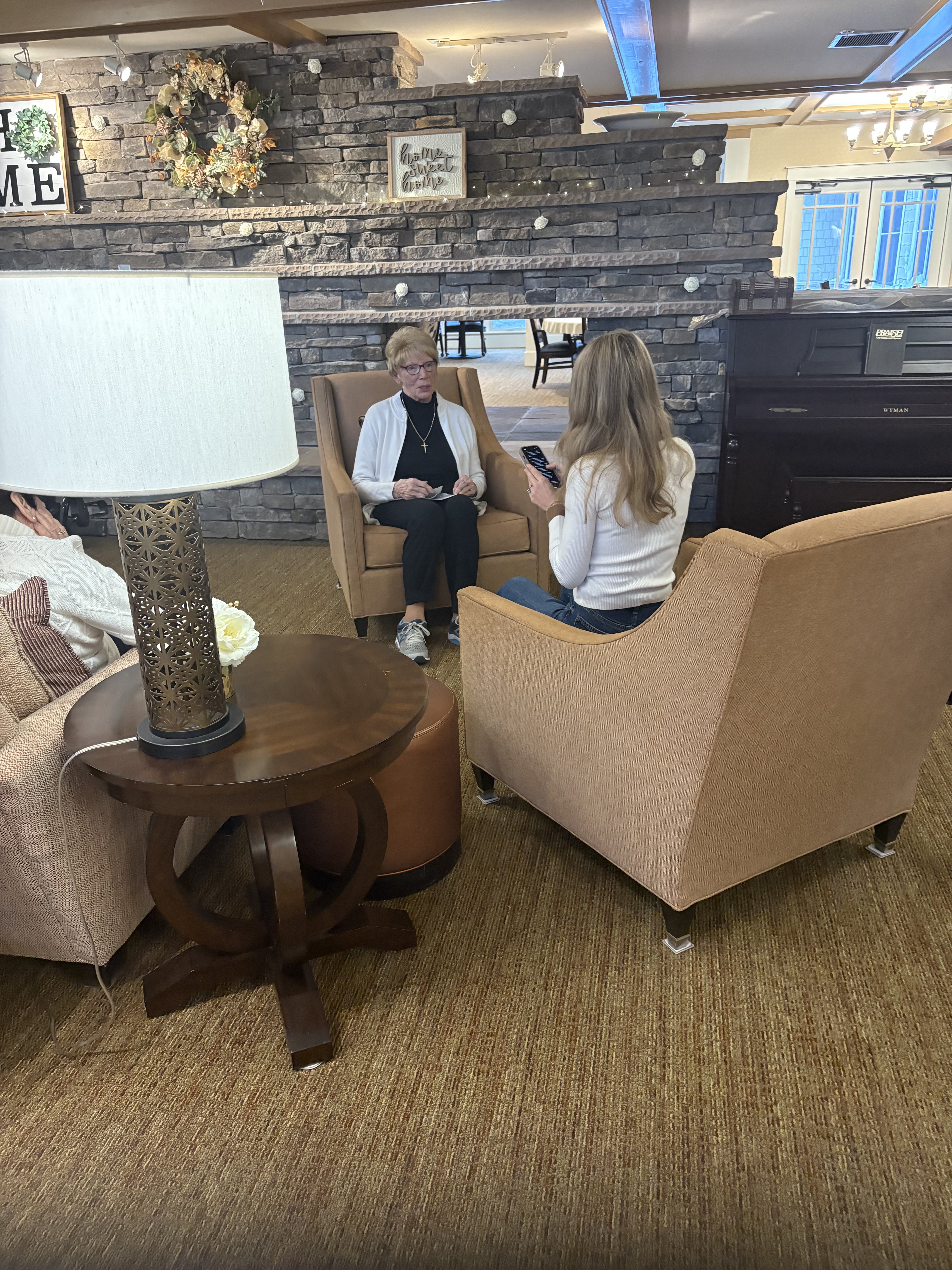 Sunrise of Cascade resident being interviewed by a reporter