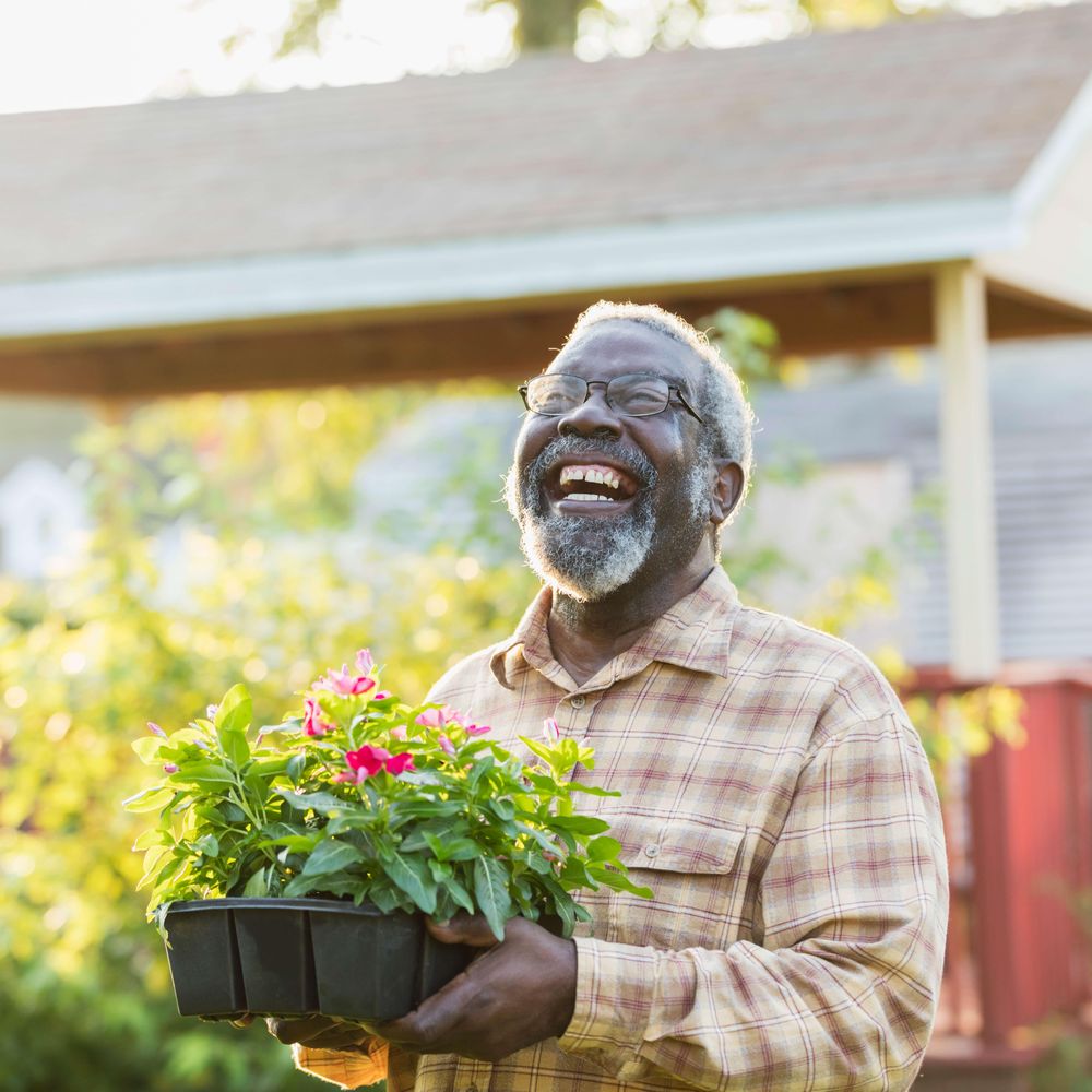 resident gardening and laughing