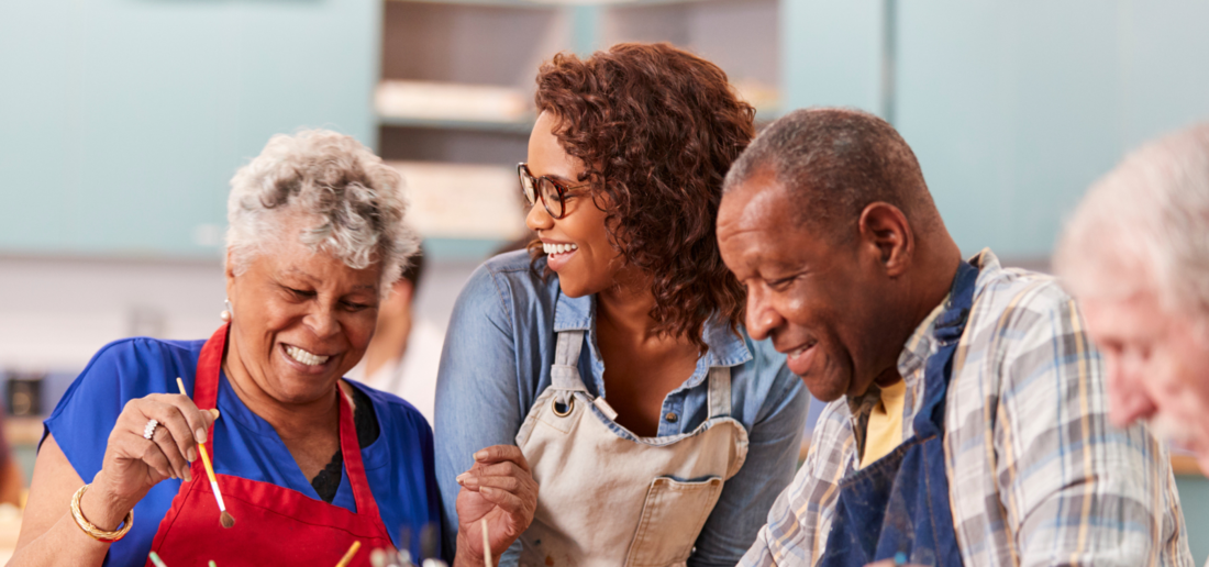 African American couple enjoys a painting session at their senior living community