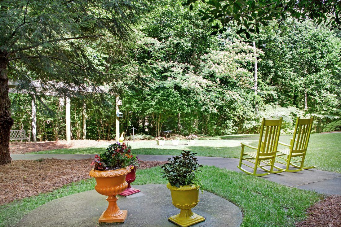 Exterior Sitting Area at Sunrise at Huntcliff Summit II, GA Assisted Living