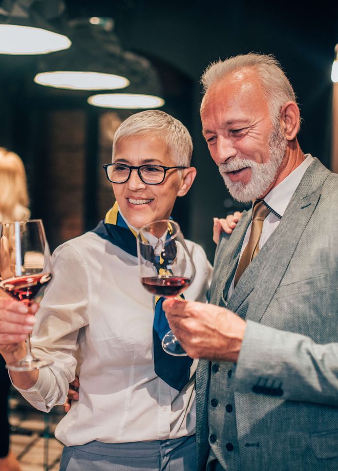 Couple having a drink at a formal event.