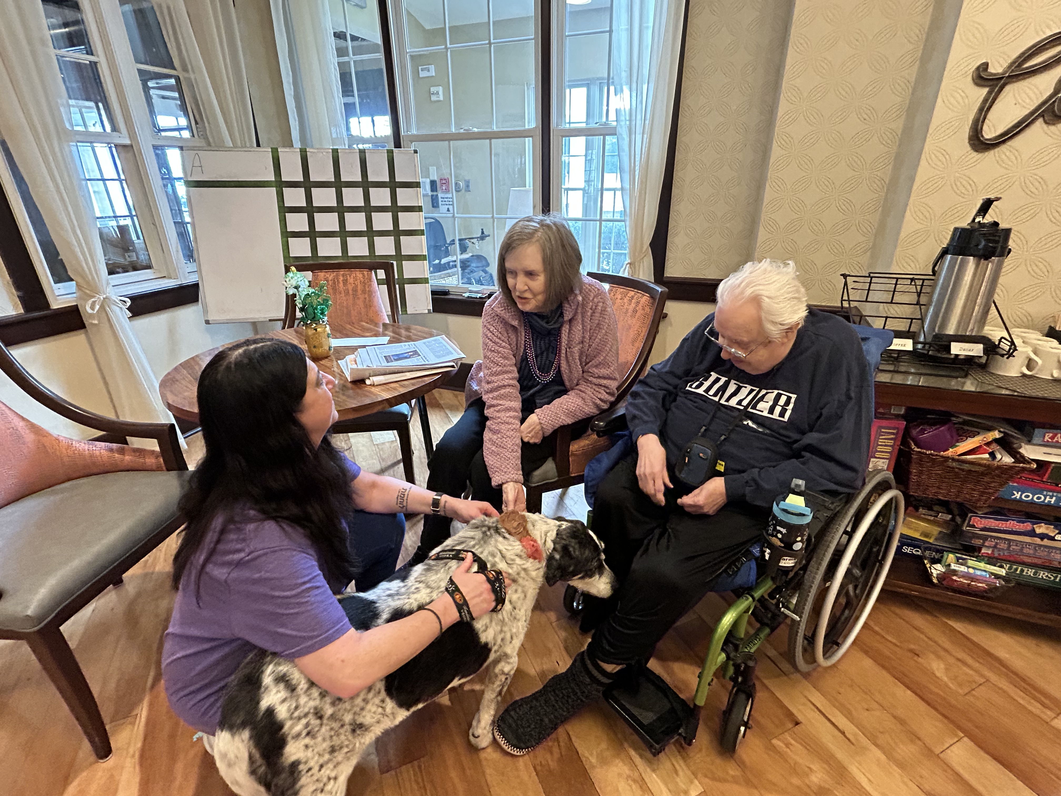 Residents petting the community dog