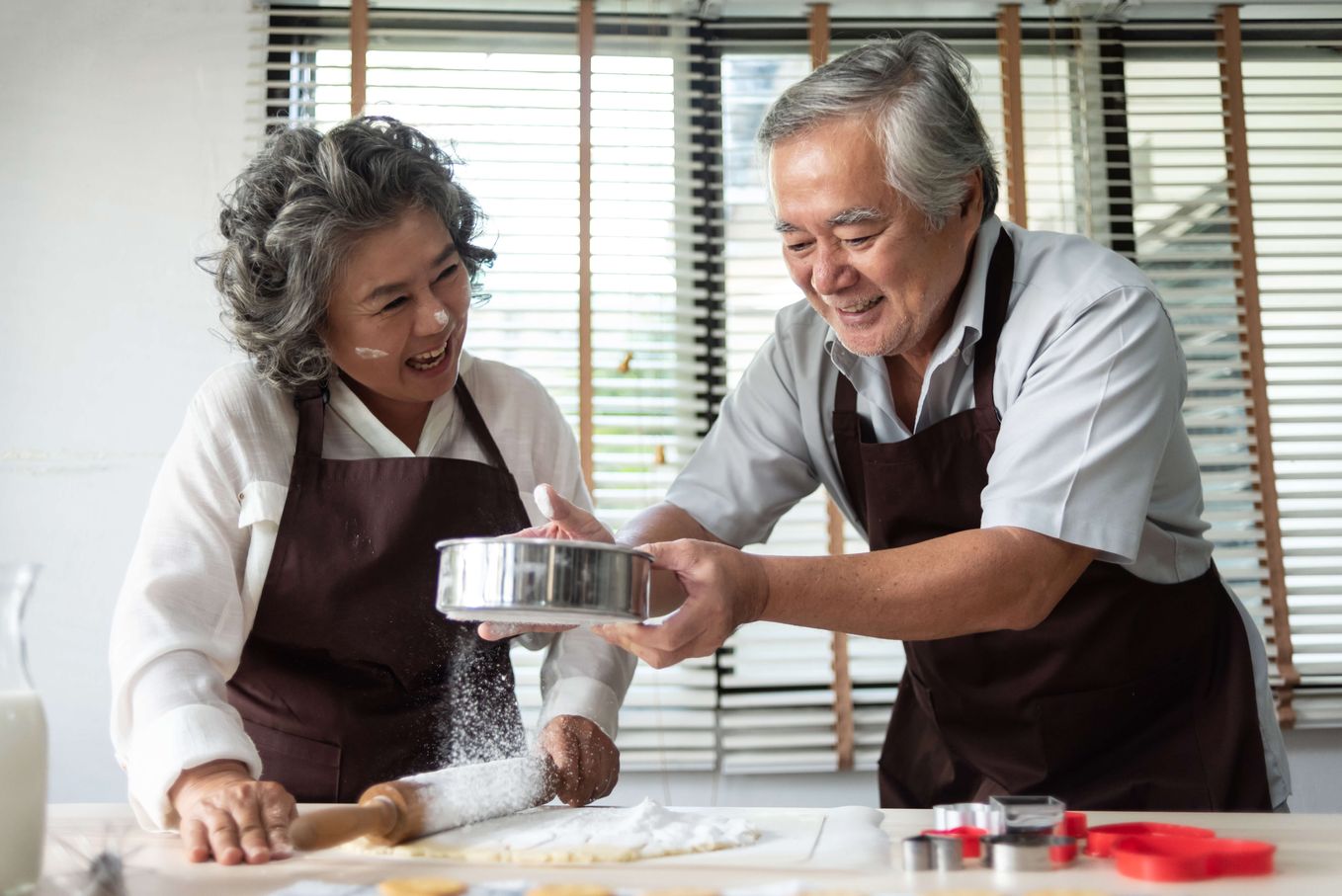 Couple baking cookies