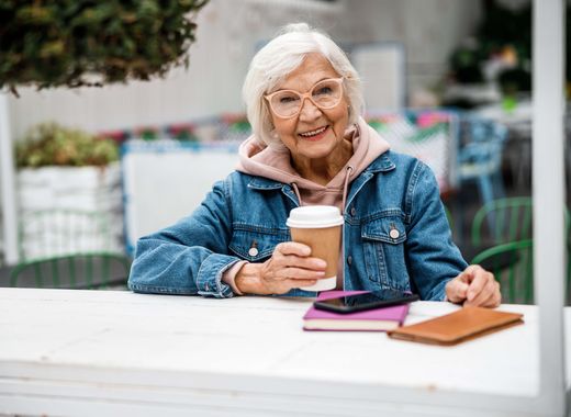 Older Woman at an Outdoor Coffee Shop