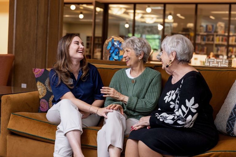 Residents talking to care manager at the community