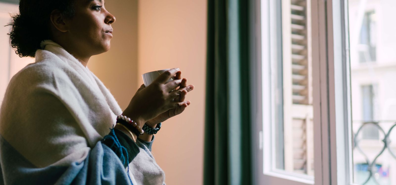 Female adult child looking out window