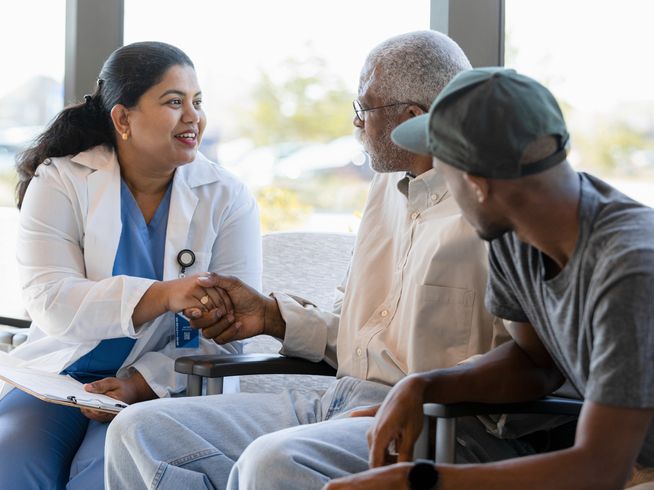 Doctor talking to senior about the stages of dementia.