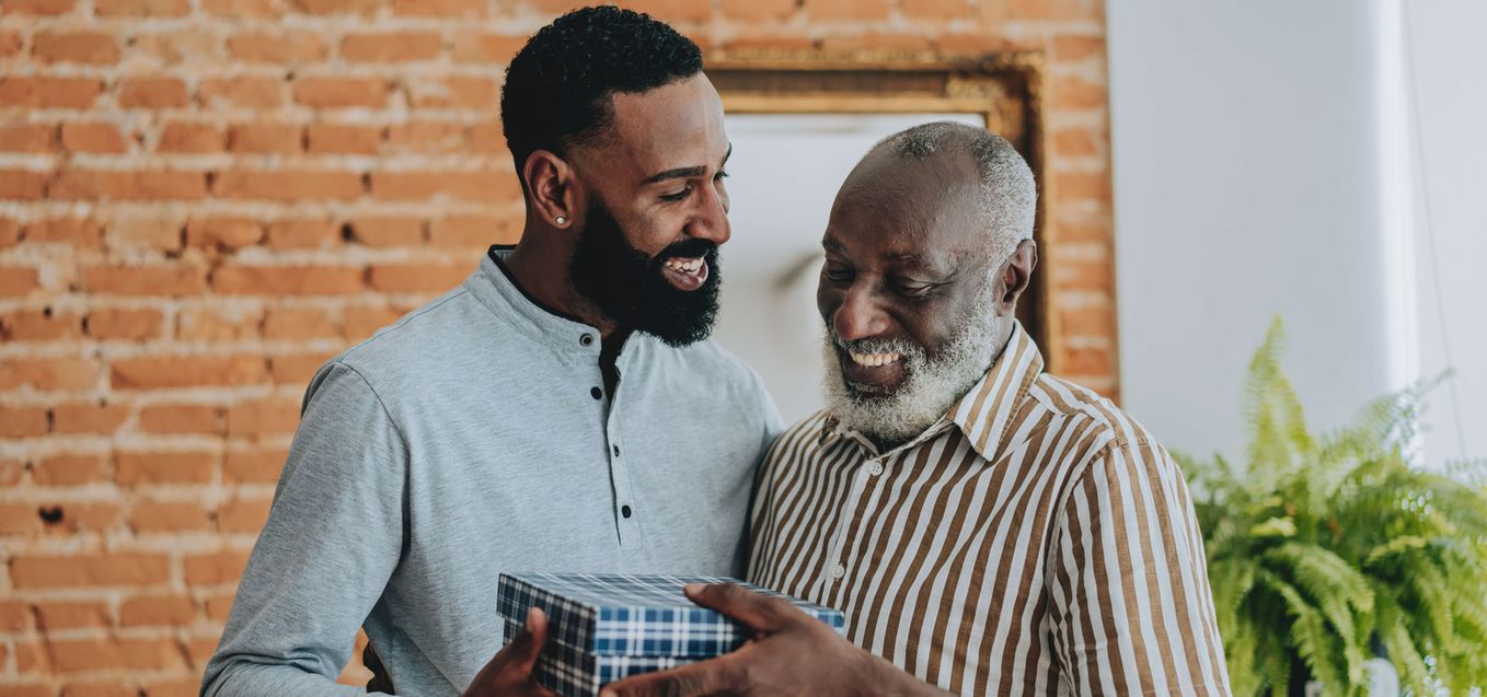 Father receiving a gift from son