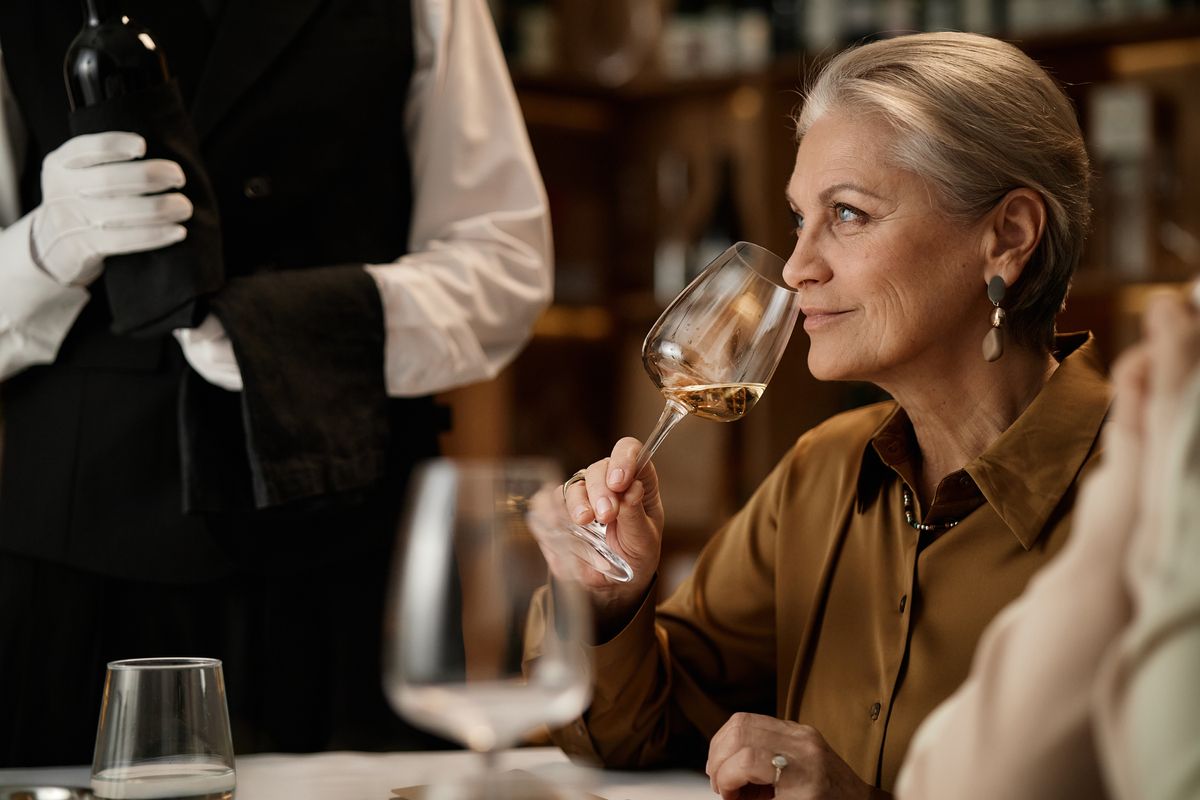 Senior woman drinking wine 