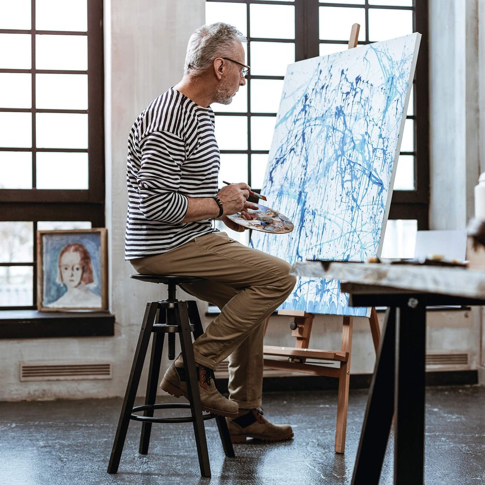 Resident painting in studio