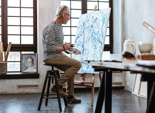 Resident painting in studio