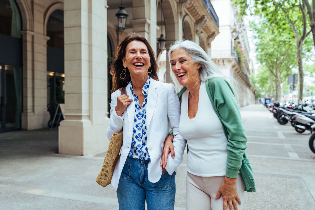 Mother and daughter walking in the city