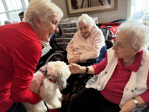 Residents petting the community dog