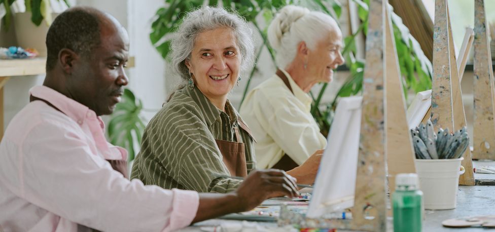 Senior living residents taking an art class